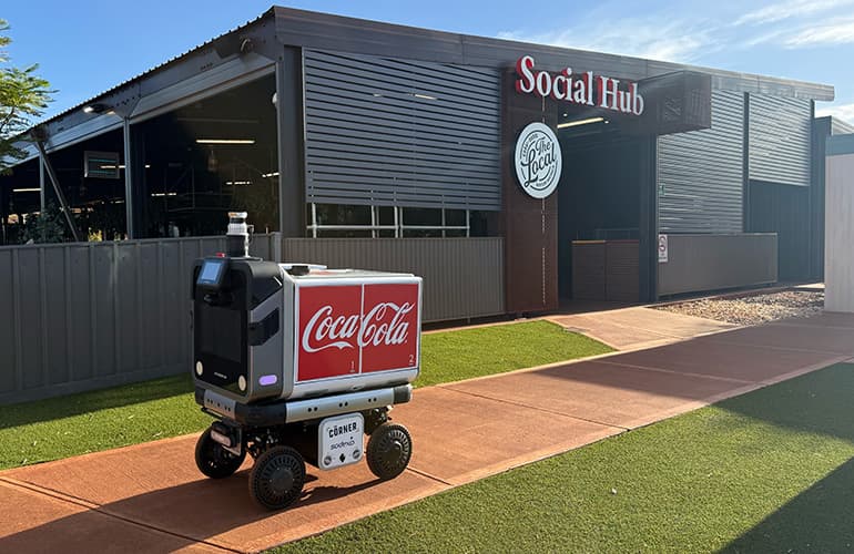 an ottobot makes a delivery to a customer at the central recreation facility.